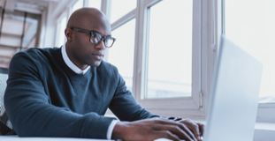 Man using laptop to apply for a credit card after bankruptcy
